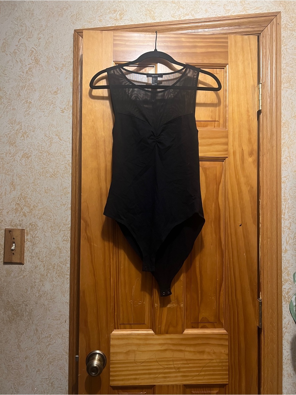 Sleeveless Black Bodysuit with Sheer Yoke
